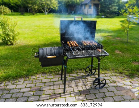  grilled meat   over the coals on a barbecue Royalty-Free Stock Photo #333172994