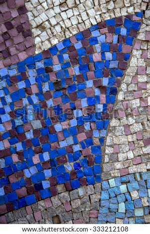 Blue modern blue background bottom of a swimming pool. Small glass tiles lined with rows of white tiles Venetian mosaic