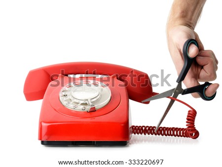 Cutting telephone cord isolated on a white background Royalty-Free Stock Photo #333220697