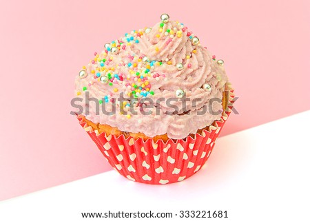 Cake with Cream, Cupcake on Pink Background. Studio Photo