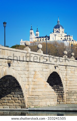 medieval bridge's view on historical cathedral in madrid