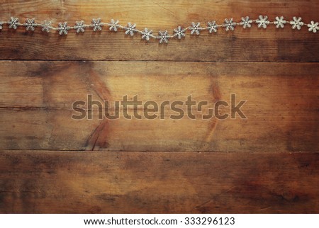 image of christmas festive decoration on wooden background. retro filtered
