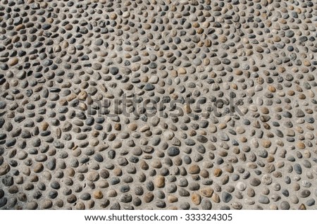 background of colorful cobblestone pavement with round rocks