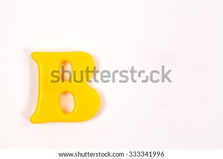 Colorful plastic alphabet letter set isolated on white background.
