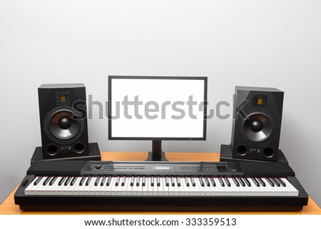 digital audio workstation (daw) studio with electronic piano and monitor speakers