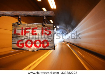 Life is good motivational phrase sign on old wood with blurred background