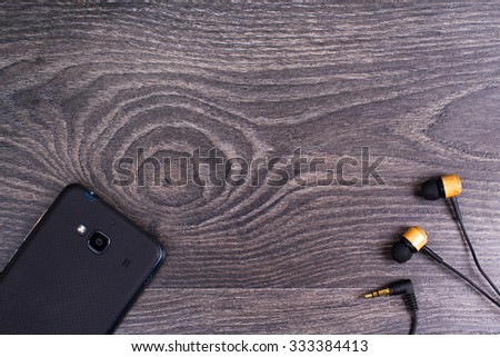 Earphones and phone on a table