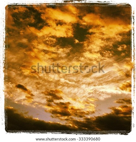 Dramatic clouds in yellows and golds
