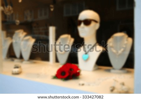 The blurry focus scene of accessory showcase display cabinet of the shop represent the shopping and business concept related idea.