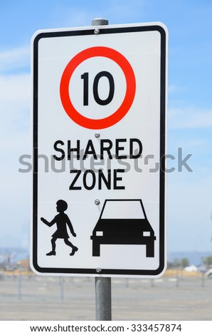 Shared zone speed limit warning road sign