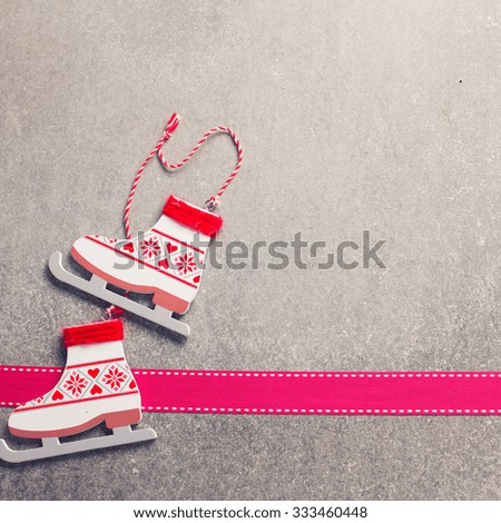 Decorative decoration   and ribbon on  grey slate  background.  Selective focus. Place for text. Square image.