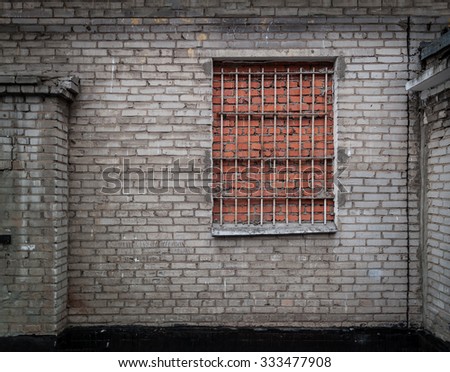 Brick wall background with window made of bricks. Ultimate security against burglary.