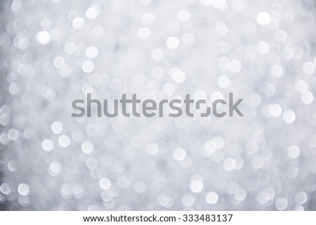silver and white bokeh lights defocused. abstract background Royalty-Free Stock Photo #333483137