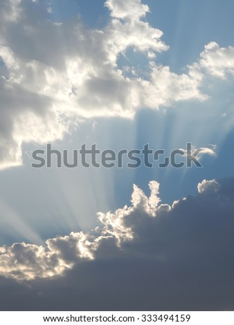 Sun in the blue sky with clouds. Brightly sunlight                               