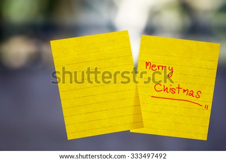 merry chistmas word sticky note on window mirror