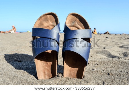 Photo Picture of Slippers on the Sand Beach