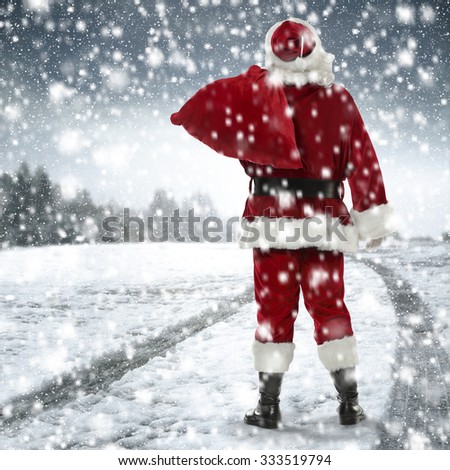 big santa claus road of snow and big red sack and snow 