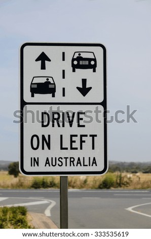 Drive on left in Australia warning road sign