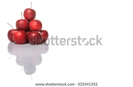 Crab apple fruit over white background