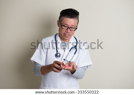 Asian doctor with medicine 