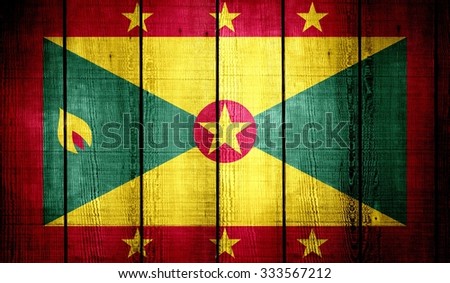 Grenada Flag on old wood texture background