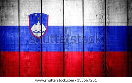 Slovenia Flag on old wood texture background