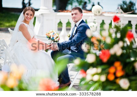 happy fashionable wedding couple on wedding ceremony of registration