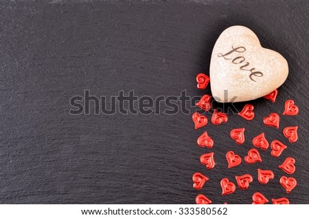 Valentines day hearts on black stone. Background, holiday card.