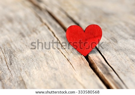 Valentines day red heart on old wood. Holidays card with copy space. 
