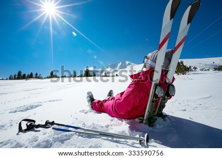 
Skier relaxing at sunny day on winter season with blue sky in background Royalty-Free Stock Photo #333590756