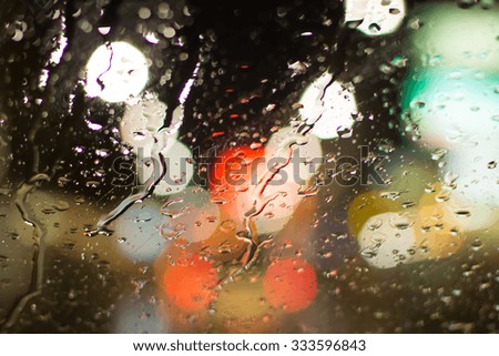 Abstract blurry traffic road bokeh light view from inside a car