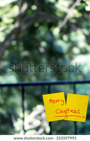 merry chistmas word sticky note on window mirror