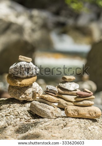 Stacked rock tower in nature, man made.