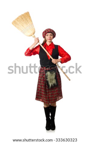 Funny woman in scottish clothing with broom