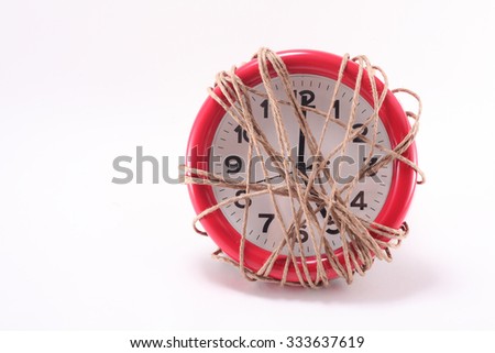 rope tied on red clock , creative idea for salary man suffer depress in company