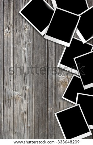 photos laid on wooden table background.