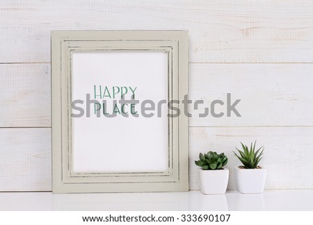 Home and family  and happiness concept. Happy place poster in frame rustic , shabby chic, vintage style. Scandinavian style home interior decoration. 
