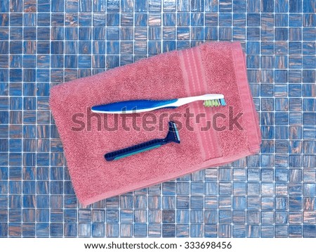 A studio photo of tooth brushes on a bath towel