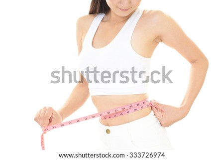 Woman who is measuring her waist
