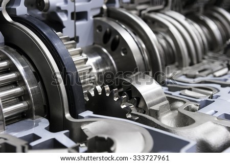 Gearbox cross-section, automotive transmission with sprocket and bearing mechanism for commercial trucks, cargo, and construction vehicles, selective focus  Royalty-Free Stock Photo #333727961
