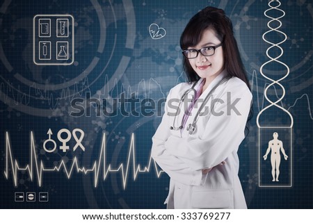 Female doctor standing in front of medical background