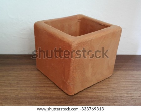 earthenware handmade, Orange Terracotta Pot with Soil Isolated
