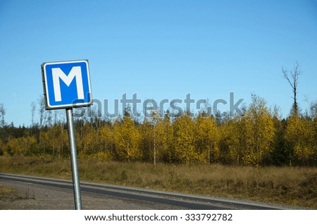 Passing point road sign in a  fall colored landscape