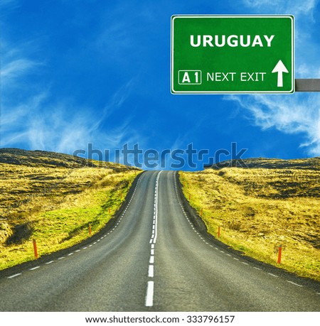 URUGUAY road sign against clear blue sky