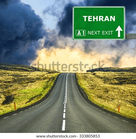 TEHRAN road sign against clear blue sky