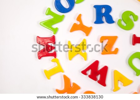 Cute and colorful Plastic   alphabet letter set. Concept of back to school. Shot with natural light. Slightly defocused and close-up shot. Copy space.