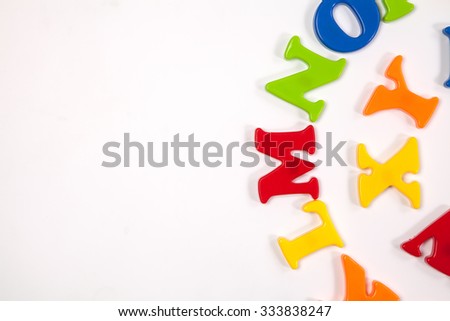 Cute and colorful Plastic and magnet  alphabet letter set. Concept of back to school. Shot with natural light. Slightly defocused and close-up shot. Copy space.