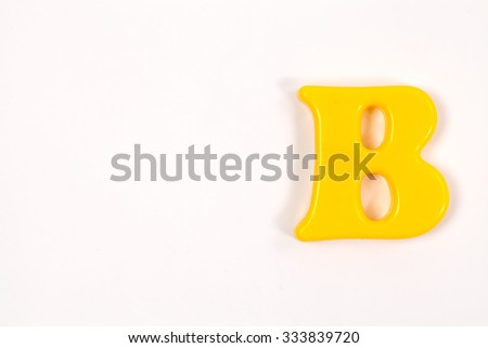 Colorful plastic alphabet letter set isolated on white background.