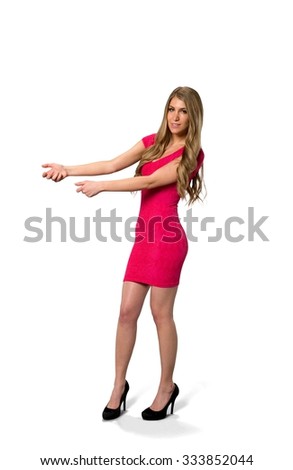 Friendly Caucasian young woman with long light blond hair in evening outfit holding invisible object - Isolated