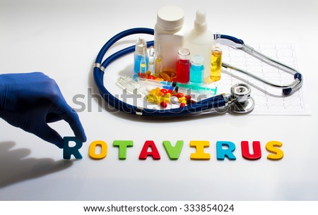 Diagnosis - Rotavirus. Medical concept with pills, injection, stethoscope, cardiogram and a syringe Royalty-Free Stock Photo #333854024